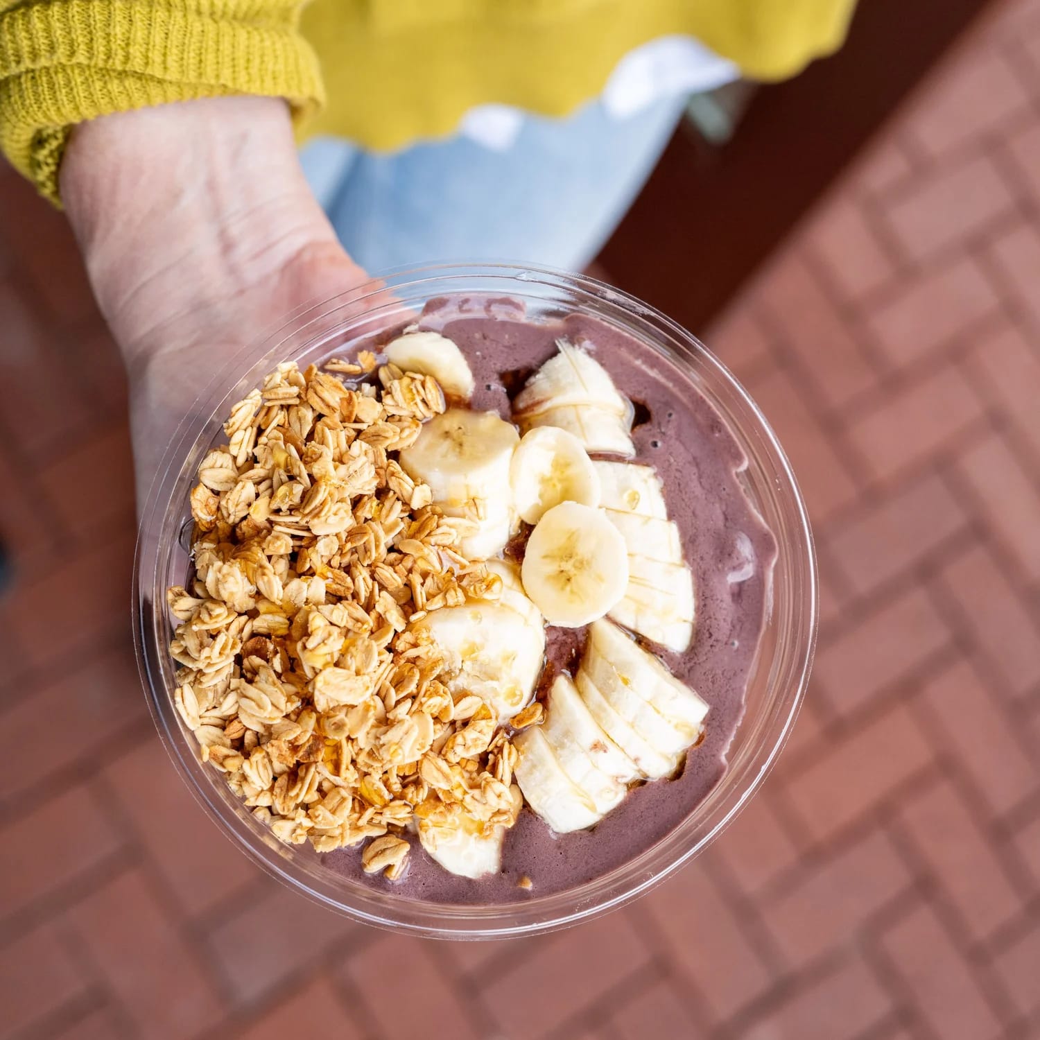 An acai bowl topped with fruit and granola